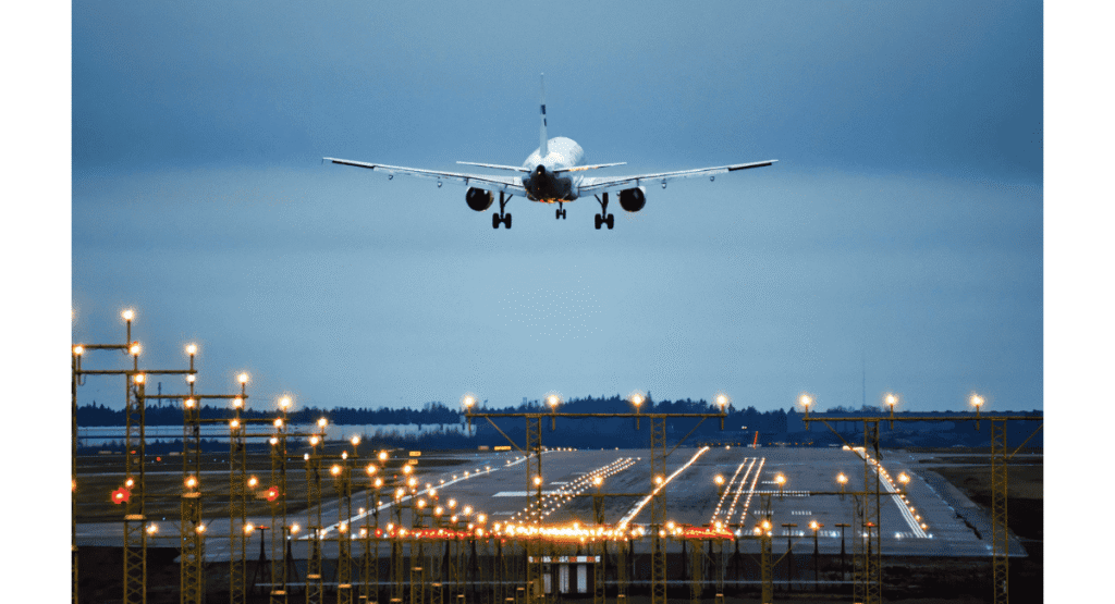 Airplane landing on illuminated runway with approach landing system