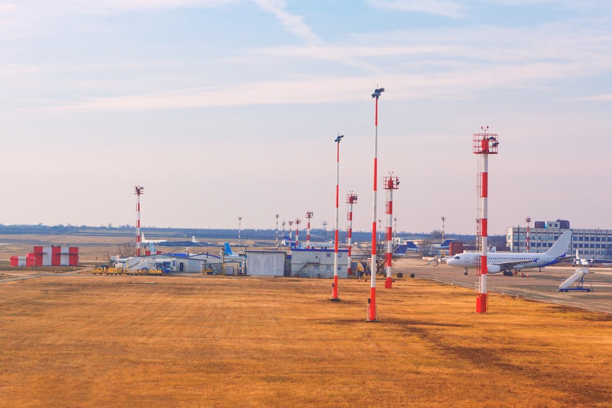 Airport with planes and control towers, and field equipment
